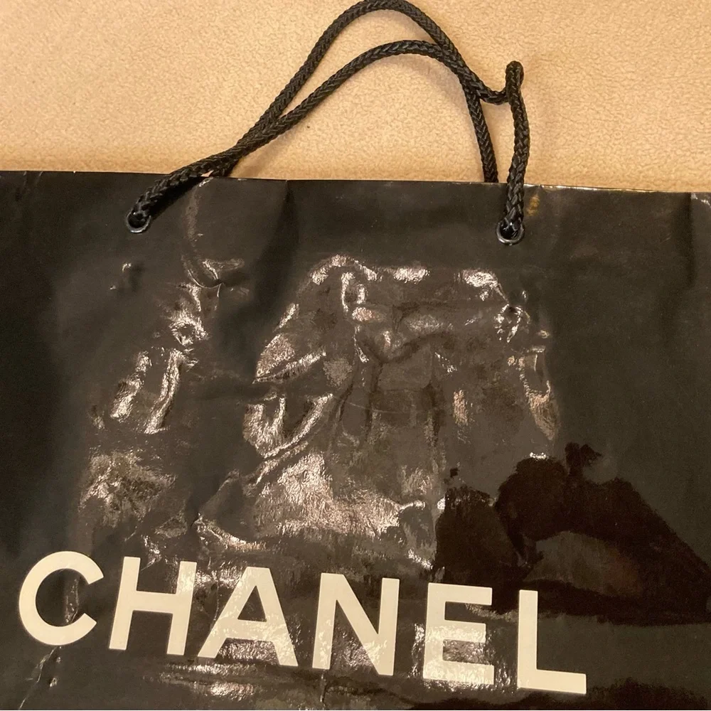 Chanel, high gloss glazed paper bag in black with White Chanel block letters